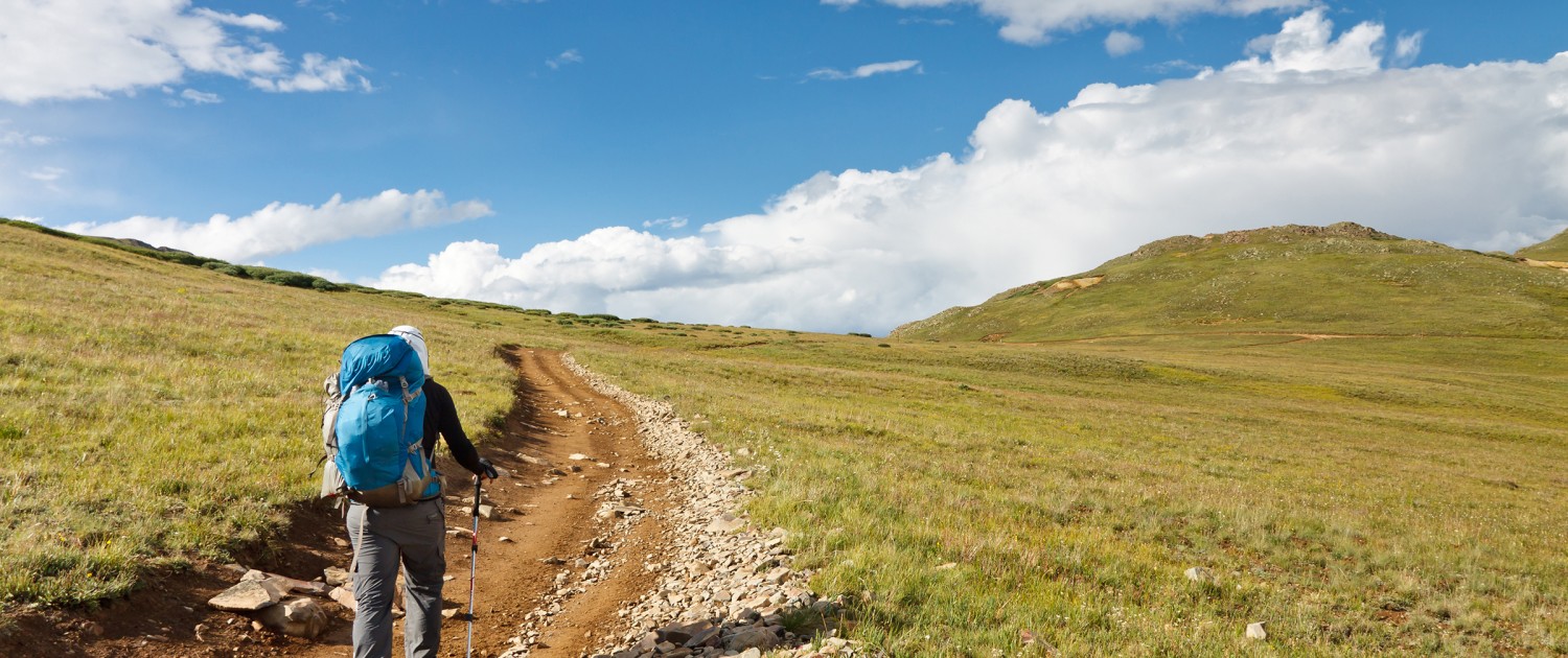backpacking through the mountains to increase health and wellness