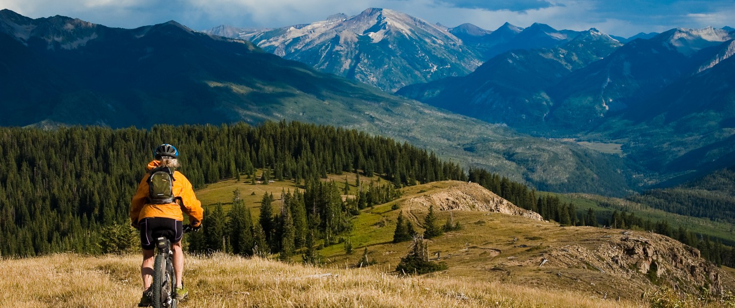 person biking through the colorado mountains to stay healthy